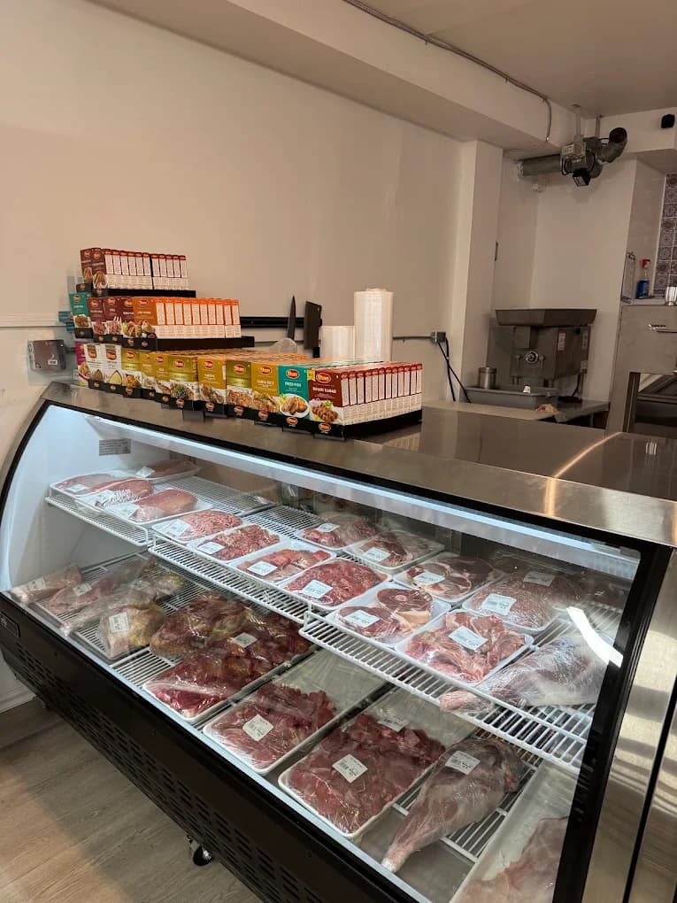 Fresh halal meat display case at KabulVan Supermarket in Surrey